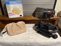 Lot overview showing both massagers and boxes