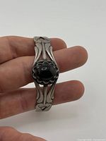 Front view showing onyx stone and scroll design