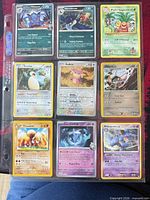 Front view of 9 Pokémon cards in binder sheet