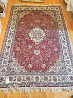Full view of rug showing design, colours, fringe