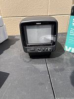 front view of RCA 5 inch CRT TV showing screen and control buttons
