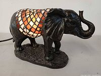 Left side view of resin elephant lamp illuminated