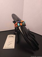 Bracelet displayed on mannequin hand showing full design