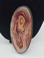 Front view showing banded jasper cabochon and silver bezel