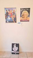 Overall view of all three Marilyn Monroe pieces on wall and floor