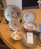 All six decorative pieces grouped on table for overall view