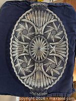 Top view of oval cut crystal platter showing star and fan pattern