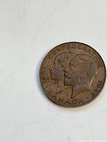 Obverse of 1927 Canadian 1-cent coin showing busts and inscriptions