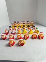 All 32 rubber ducks arrayed in rows showing various Christmas designs