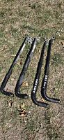 Four bars on grass showing two Eaz-Lift Elite bars with chains