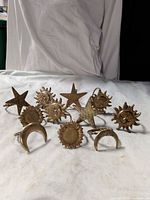 All nine brass napkin rings grouped together