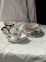 All three teacup and saucer sets arranged together