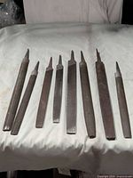 Eight assorted flat steel files lined up