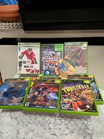 Group shot of all game cases and loose disc