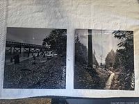 Both metal photo prints side by side on white surface
