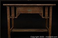 Front view showing overall form, drawer and stretcher shelf