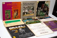 Front view of eleven world and folk music LP record sleeves
