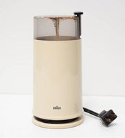 Full view of Braun KSM2 grinder showing housing, lid, cord wrap