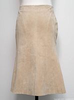 Front view of beige suede midi skirt on mannequin