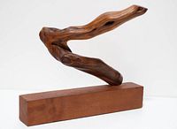 full view of driftwood sculpture on base