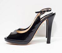 Left side profile of one shoe showing patent leather, platform and stiletto heel