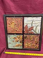 Front view showing four colored pressed-tin panels and frame