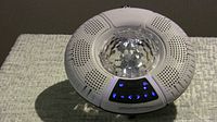 Top view of speaker with control panel lights on