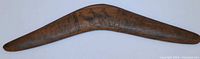 Full view of the carved wooden boomerang