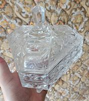 Lidded crystal candy dish showing faceted knob and etched patterns