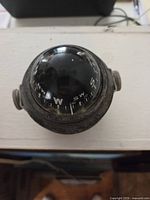 Top view showing compass dome, cardinal points, degree scale