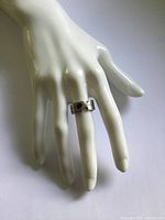 Ring on display hand showing overall design and scale