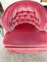 Top view of rose pink tufted barrel armchair showing upholstery and seat cushion