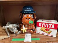 All three items grouped: cookie jar, meat grinder, Ryvita tin