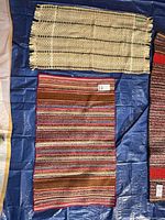 Top view showing both rugs laid on blue tarp