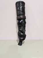 Full view of carved wooden mask front