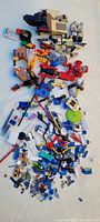 Top view of entire assortment of loose Lego pieces spread on table