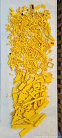 Full overhead view of entire pile of yellow LEGO parts