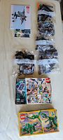 Overview showing Quinjet manual, six numbered bags, Hidden Side 70418 box, Creator 31058 box