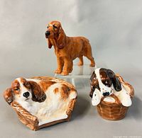 All three Royal Doulton dog figurines displayed