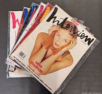 Stack of six Interview magazines in plastic sleeves, top issue Uma Thurman cover