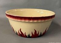 Side view showing exterior flame pattern and red rim