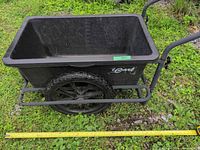 Side view of iCart cart showing plastic tub, metal frame, wheel and brand decal