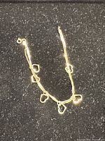 Full view of bracelet showing hearts and double chain