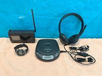 Group shot of CD player, watch, radio cassette, headphones