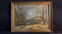 Front view of framed oil landscape painting