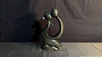 Front view of abstract stone lovers sculpture