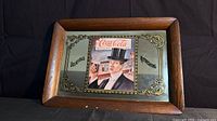 front view of Coca-Cola mirror tray showing graphic and frame