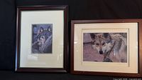 Both framed wolf prints side by side showing sizes and frames