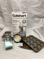 Group shot showing food processor box, loaf pans, muffin pans, springform pans