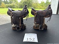 Pair of western saddle candle holders side by side on table